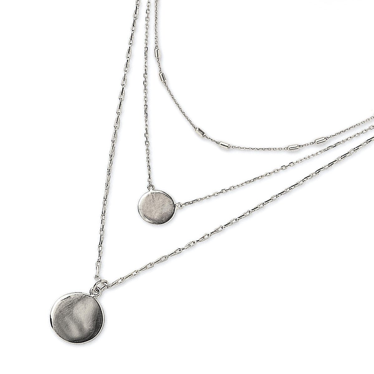 Sterling silver triple-layered necklace with two round disc pendants, on a white background