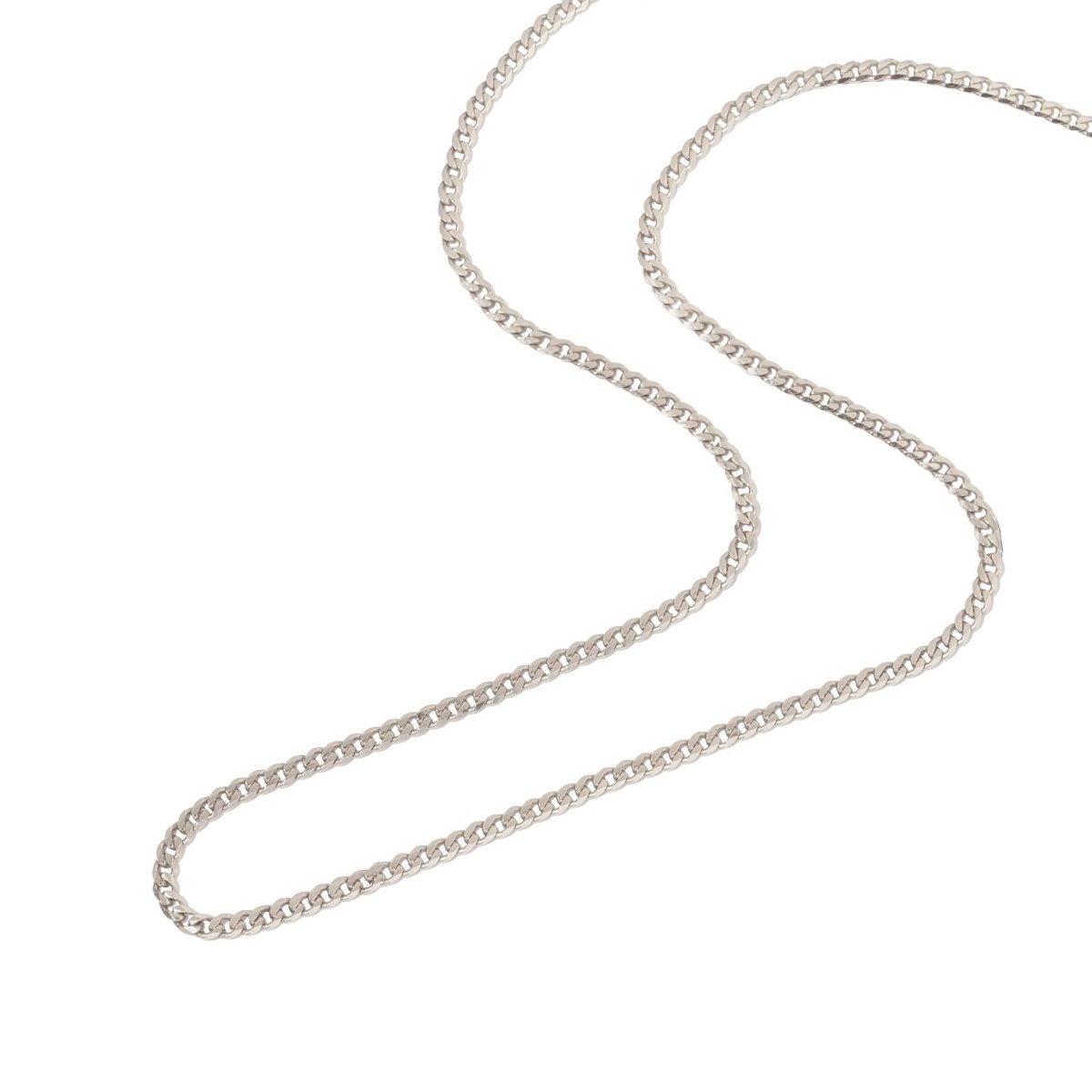 Sterling silver flat Cuban curb chain necklace layered with two finer chains, shown on a model's neckline