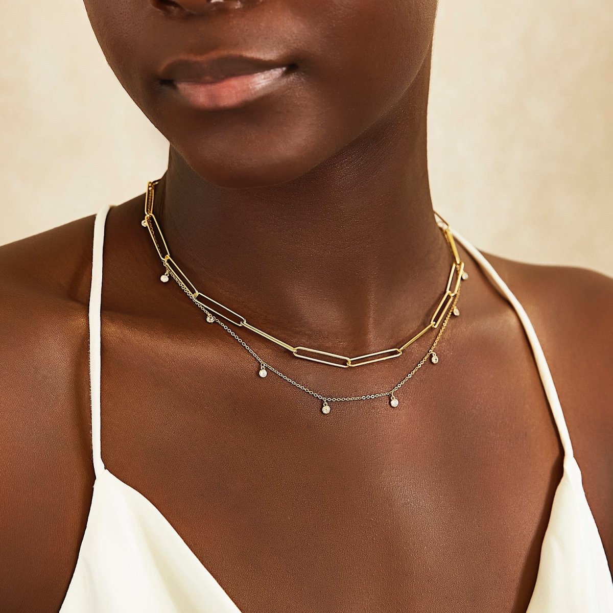 Gold vermeil long link paperclip chain necklace, layered on a model's neckline