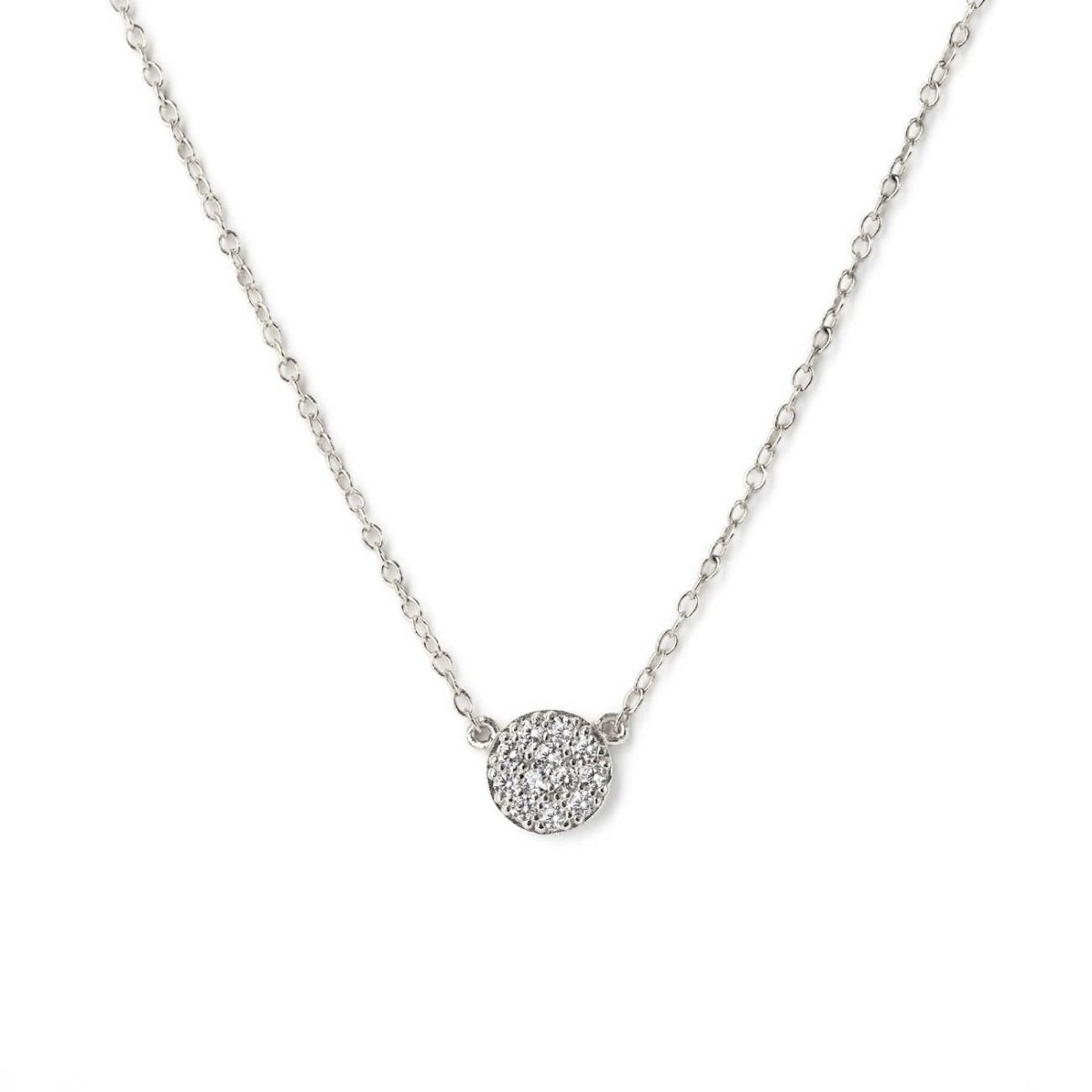 Sterling silver pavé disc necklace with white zirconia on a thin chain, on a white background