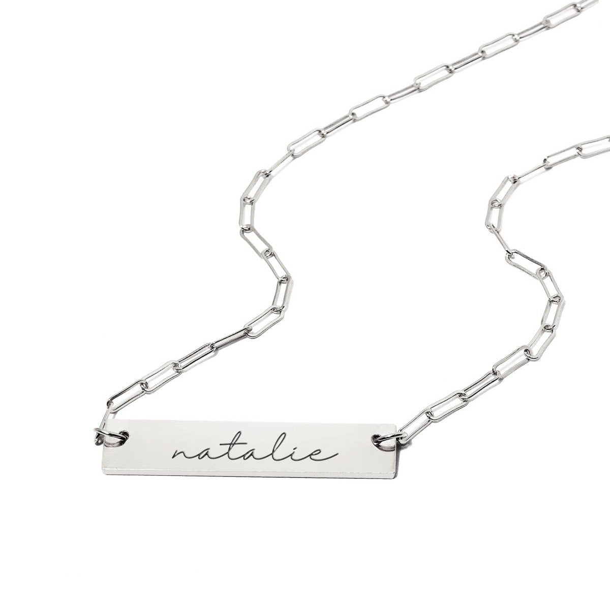 Sterling silver engravable bar necklace on a paperclip chain, bar engraved with a name, on a white background