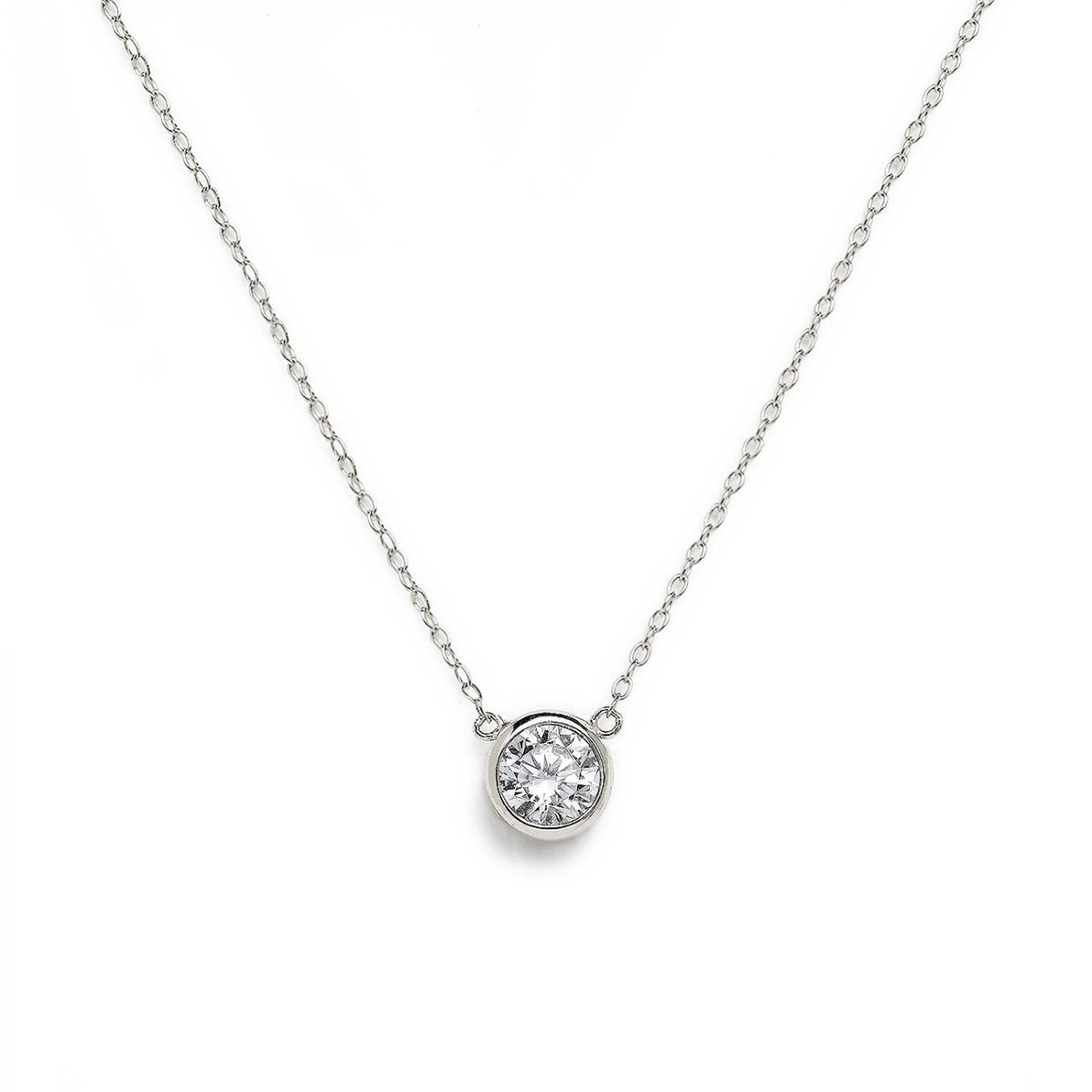 Sterling silver solitaire necklace with a round bezel-set white zirconia, on a white background