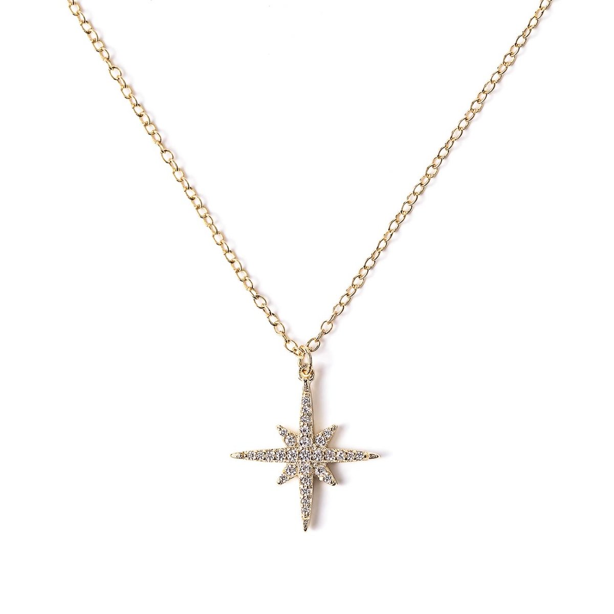 Gold vermeil starburst pendant necklace paved with clear stones, on a fine chain against a white background