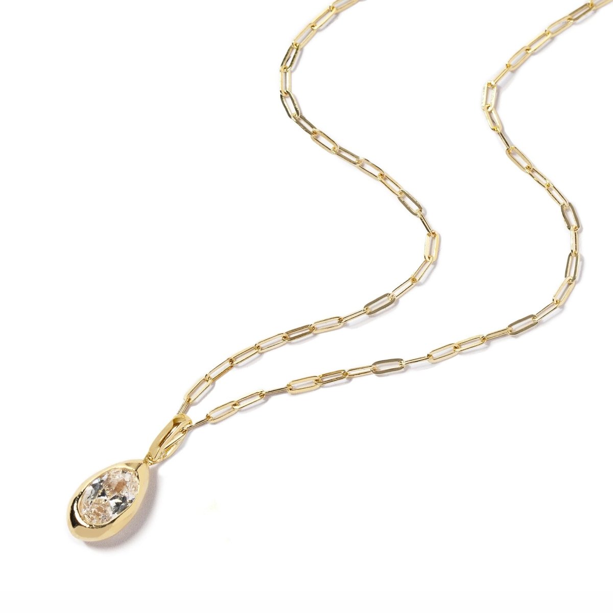 Gold vermeil teardrop pendant with a clear zirconia stone on a paperclip chain, on a white background