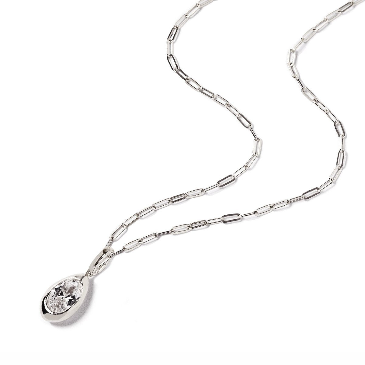 Sterling silver teardrop pendant with a clear zirconia stone on a paperclip chain, on a white background