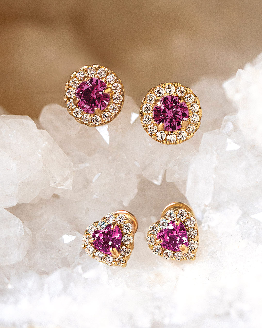 AMYO ruby stud earrings featuring round and heart-shaped ruby jewelry with sparkling halos, celebrating July's birthstone.