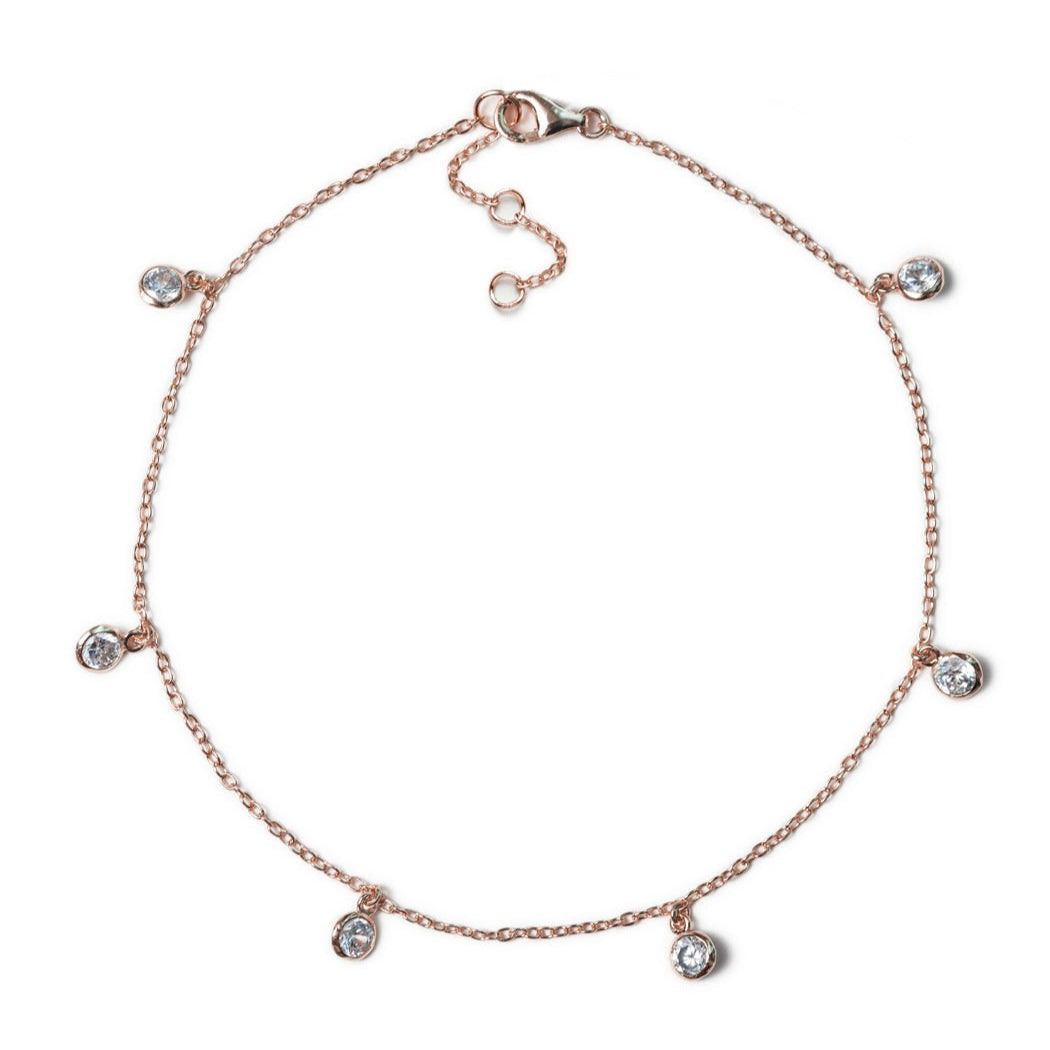 Rose gold vermeil station anklet with bezel-set clear stone drops and a lobster clasp, on a white background