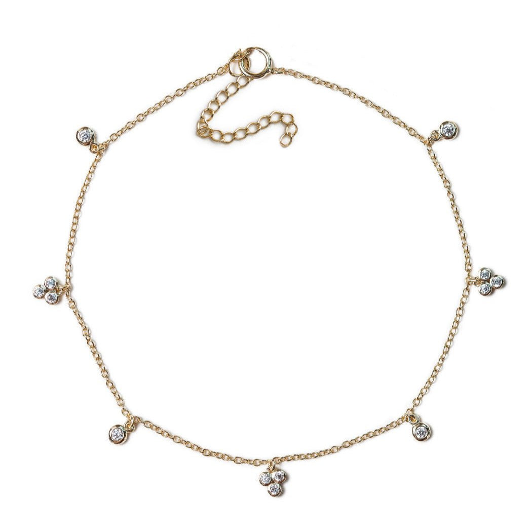 Gold vermeil clover crystal anklet with clear stone stations, on a white background