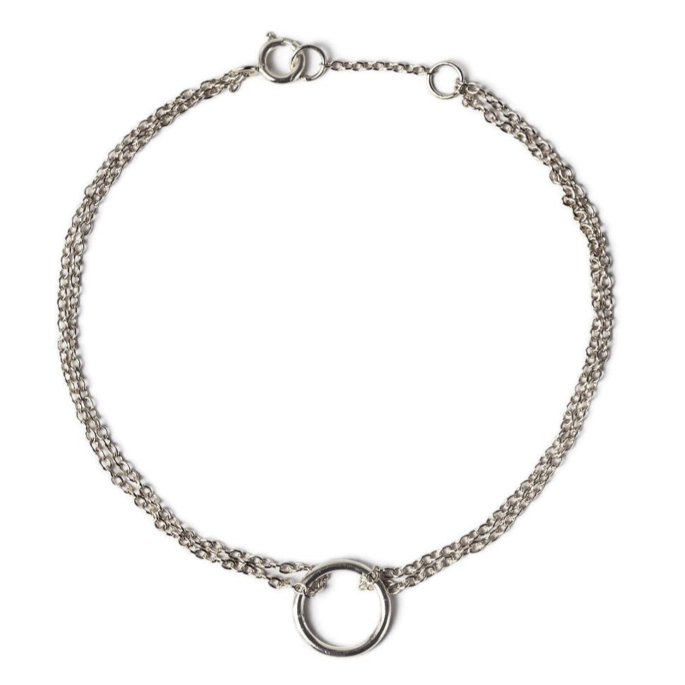 Sterling silver eternity circle bracelet with a double chain and open circle, on a white background