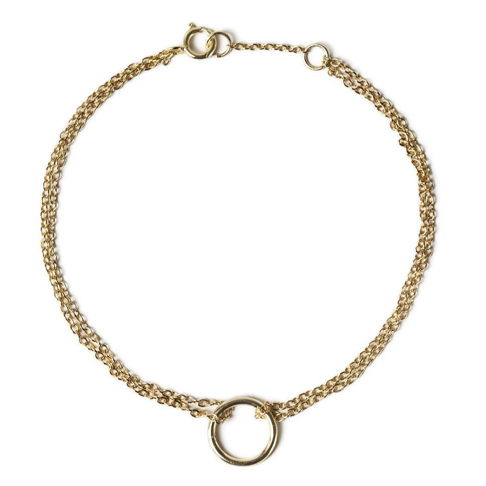 Gold vermeil eternity circle bracelet with a double chain and open circle, on a white background
