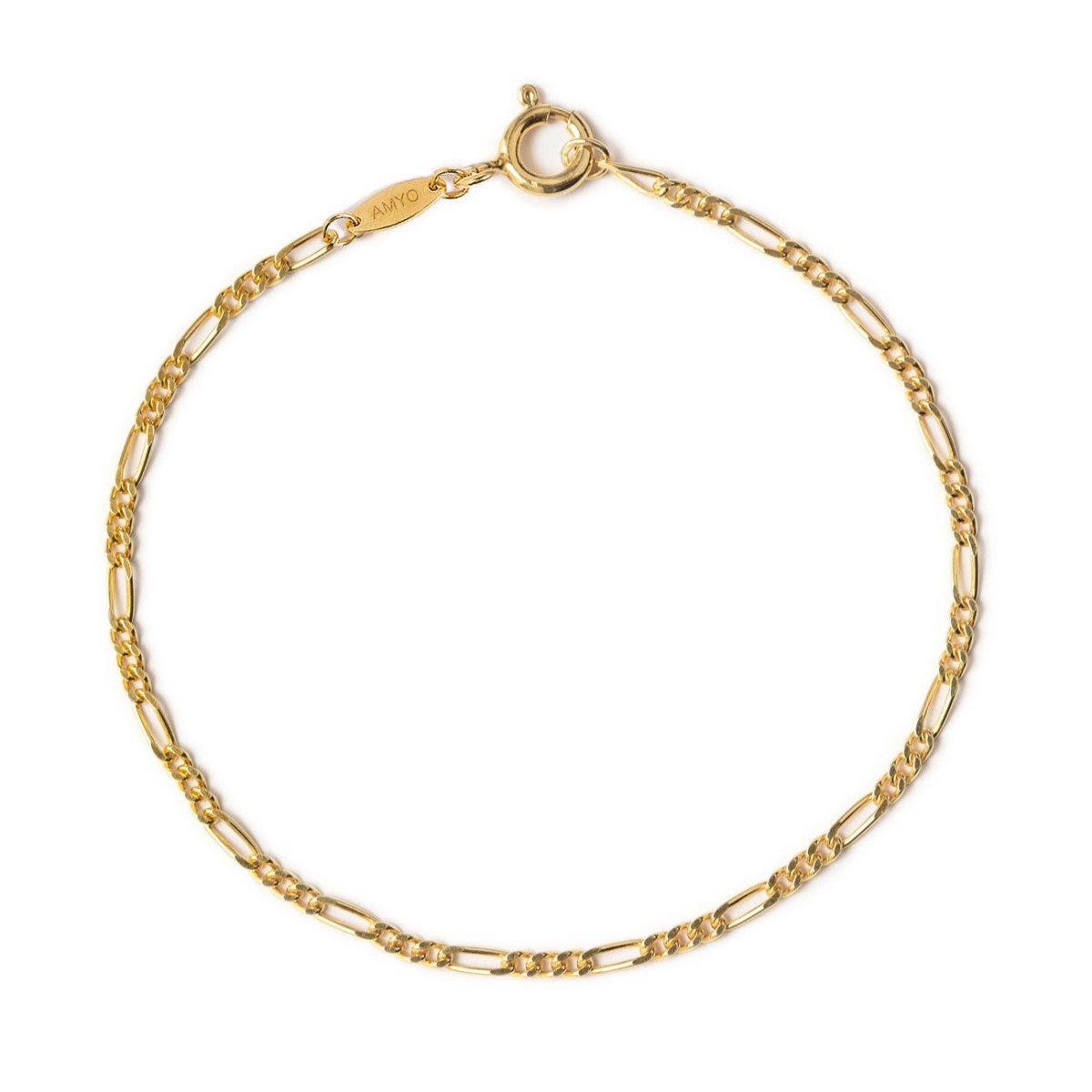 14K gold Figaro chain bracelet with a spring-ring clasp and engraved tag, on a white background