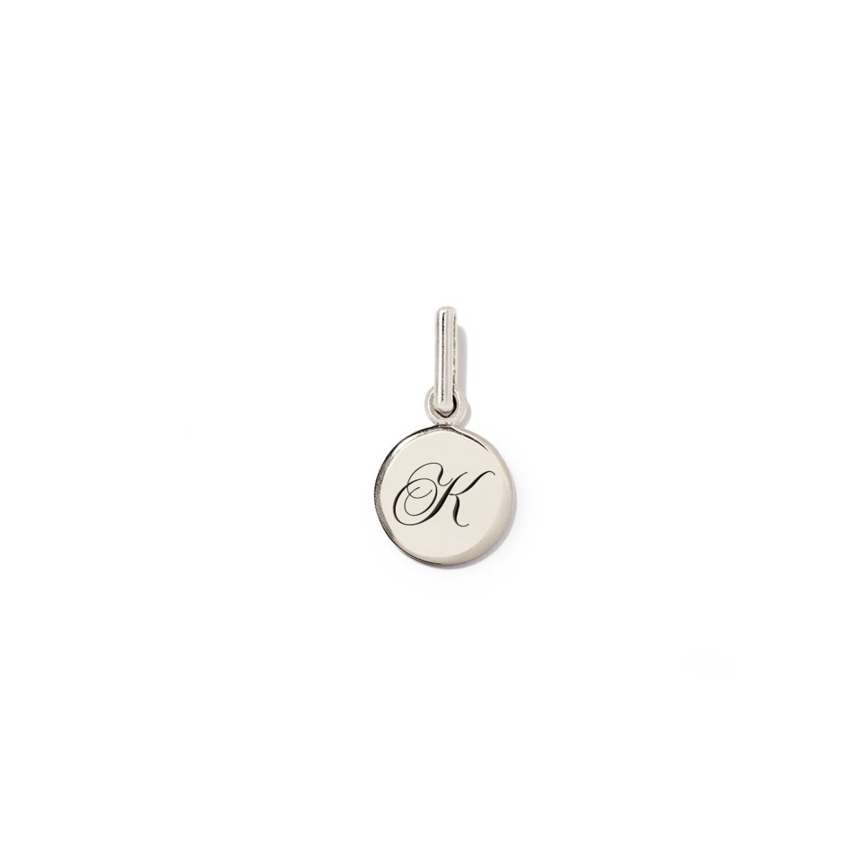 Sterling silver round disc charm engraved with an initial, on a white background