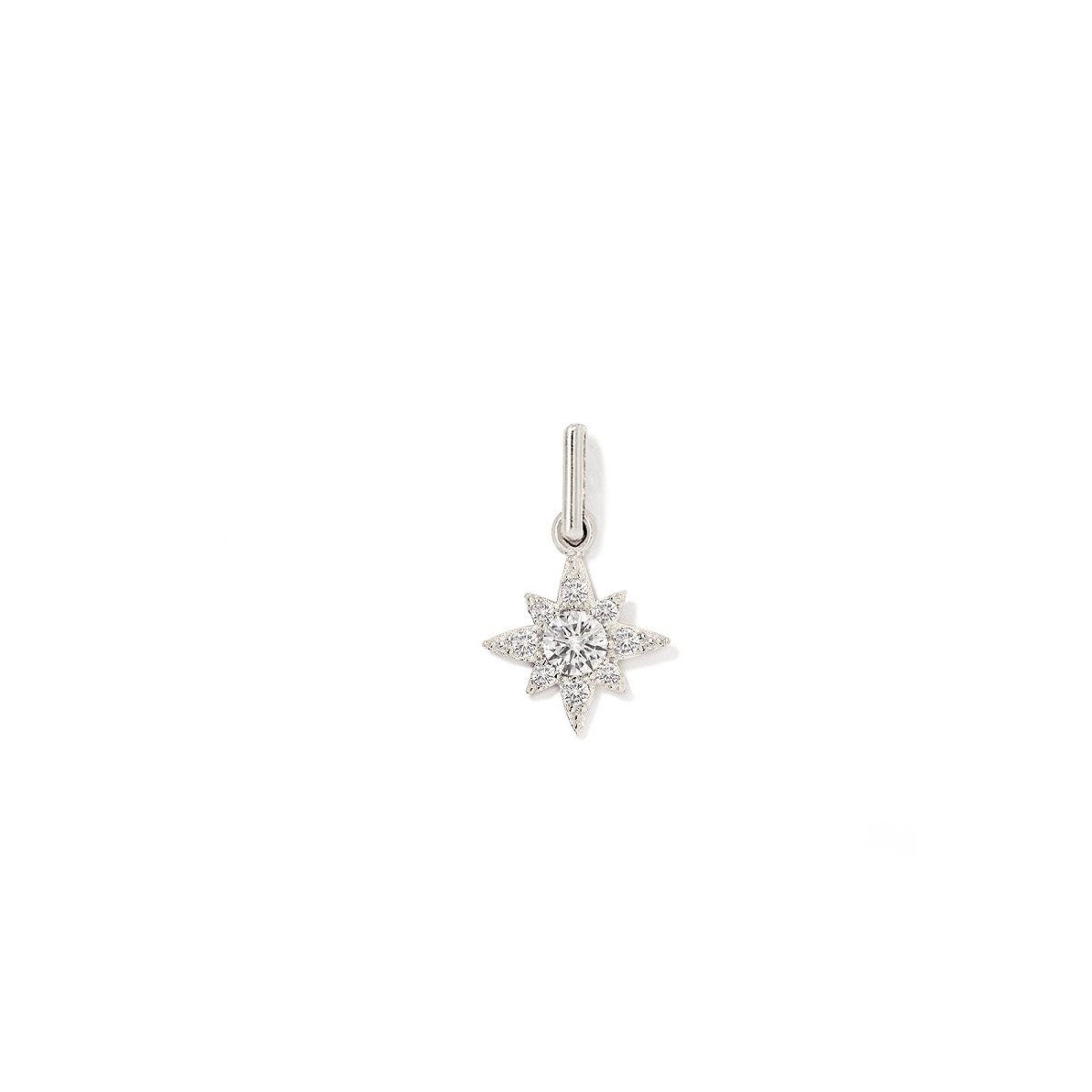 Sterling silver pavé starburst charm with a central white zirconia, on a white background