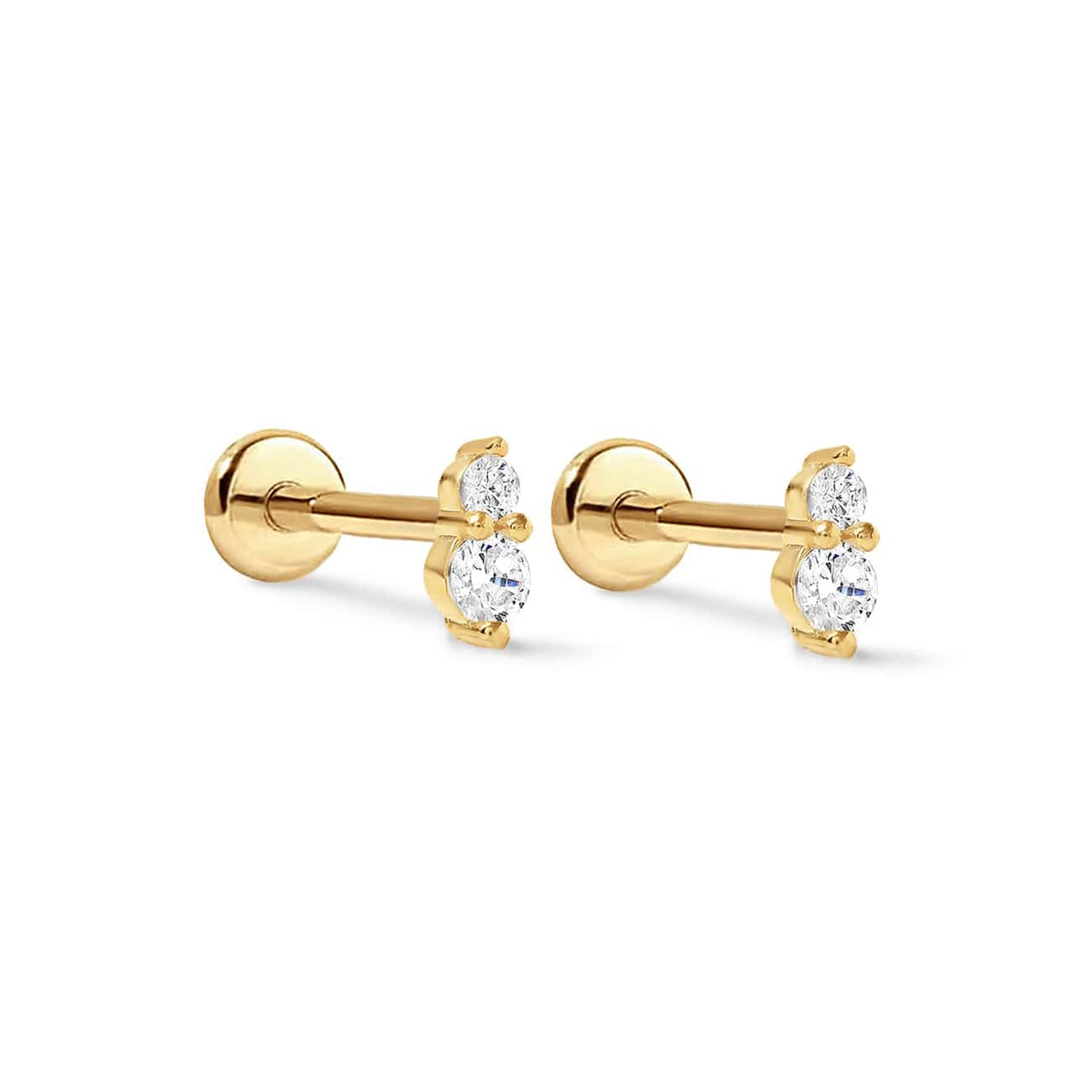 Pair of gold vermeil duo studs with two clear stones each, side view on a white background