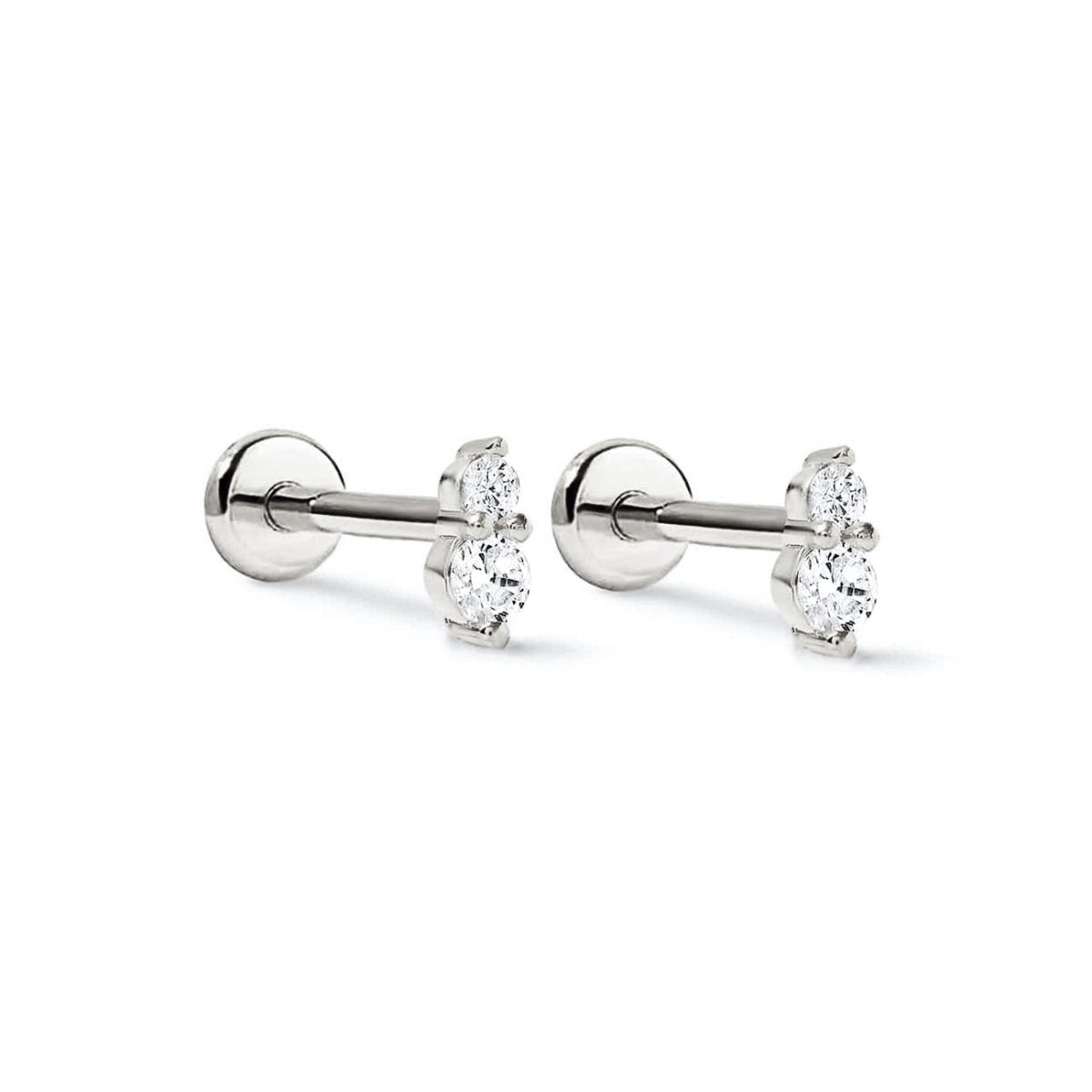 Pair of sterling silver duo studs with two clear stones each, side view on a white background
