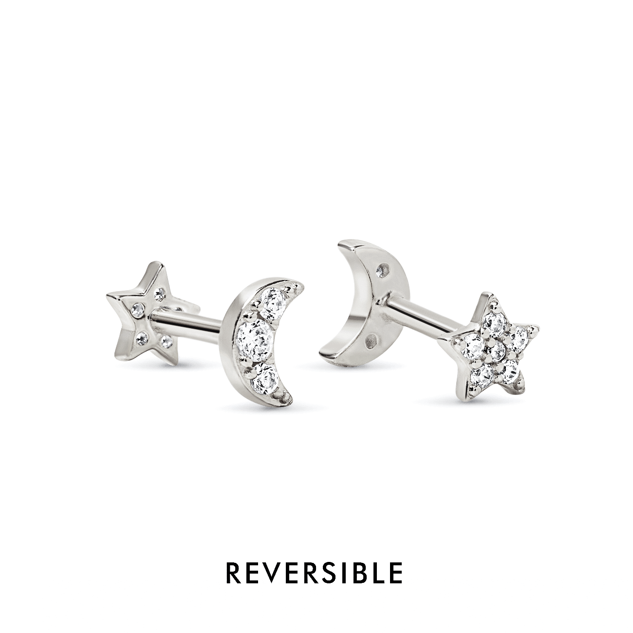 Sterling silver reversible moon and star flat back studs with clear stones, on a white background