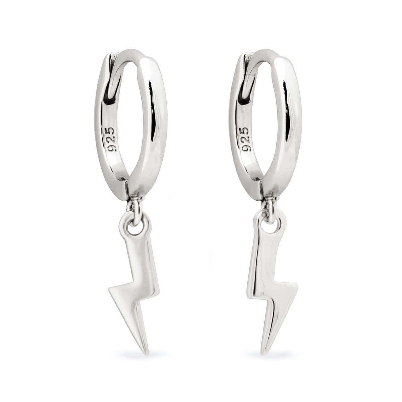 Sterling silver huggie hoops with dangling lightning bolt charms, on a white background