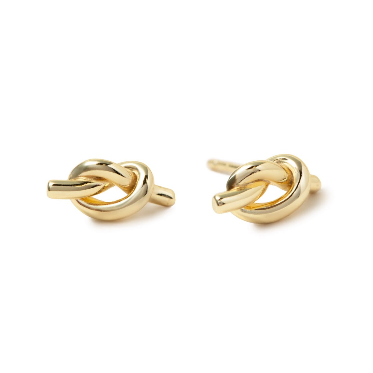 Pair of gold vermeil knot stud earrings with post backs, on a white background