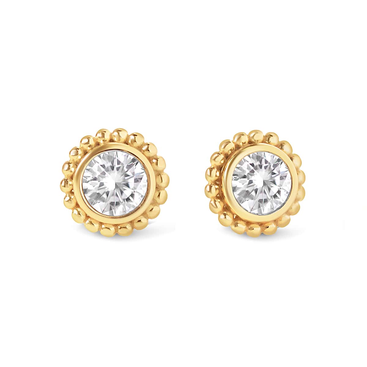 Pair of gold vermeil studs with a round clear stone framed by a beaded halo, on a white background