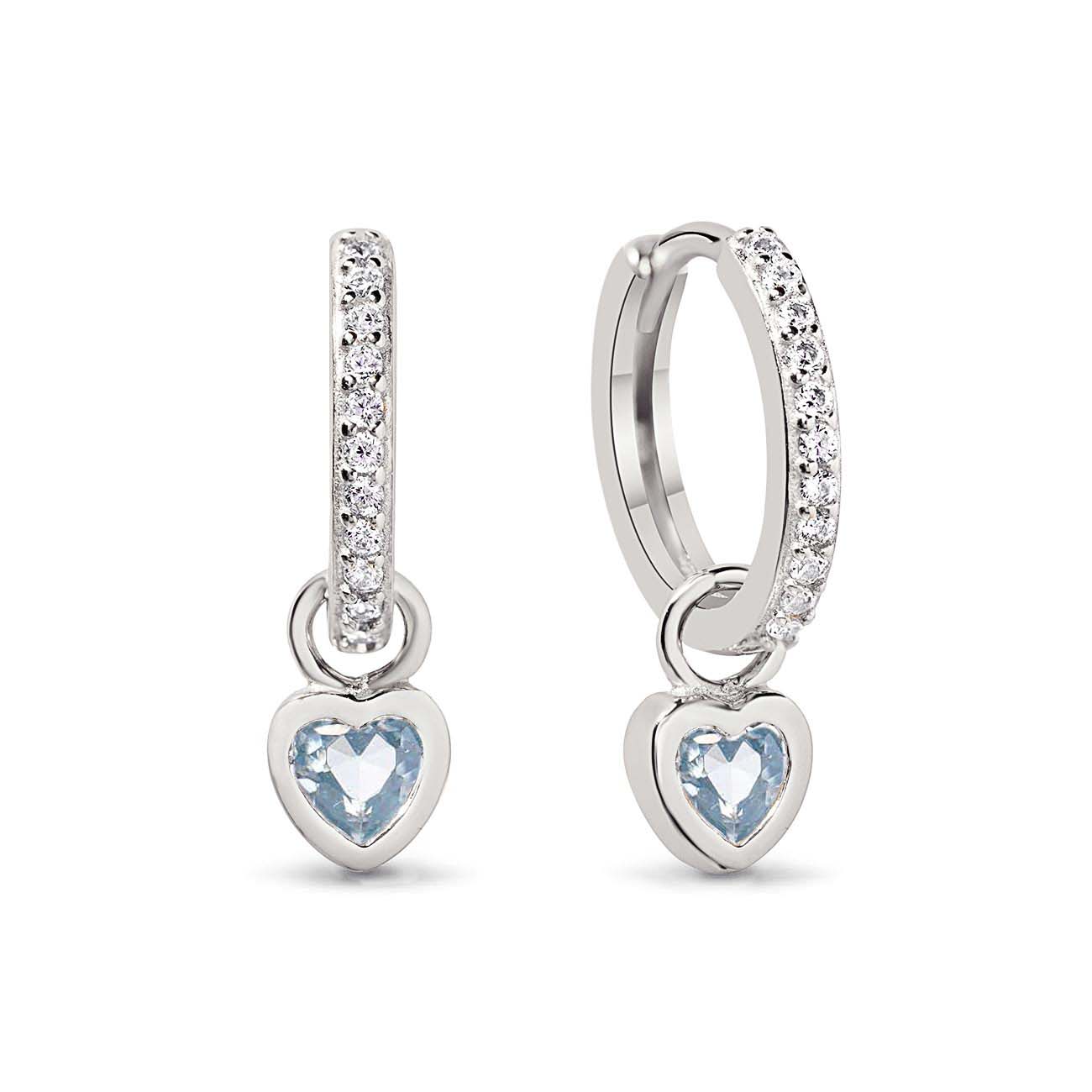 Sterling silver pavé huggie hoops with bezel-set heart-cut aquamarine charms, on a white background