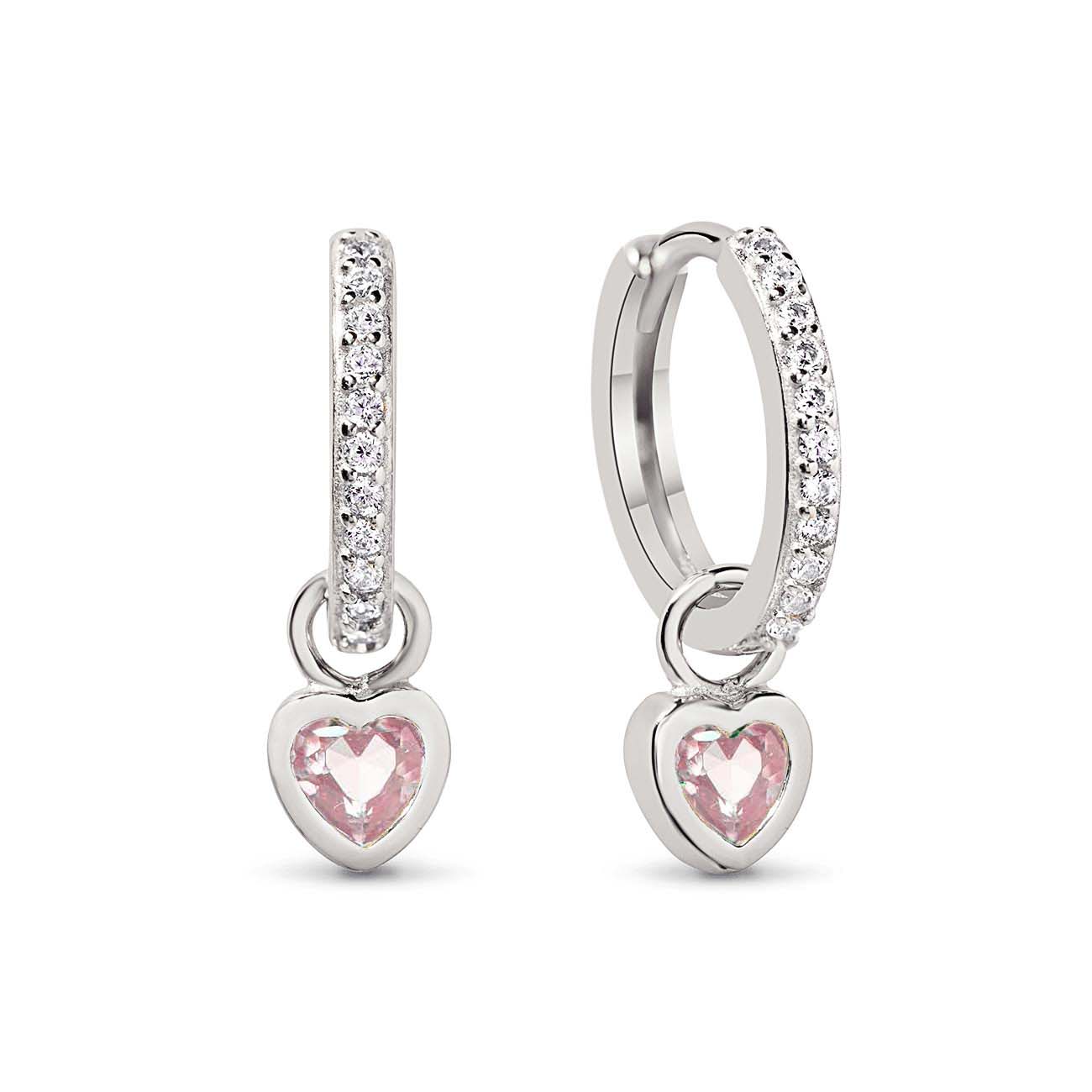 Sterling silver pavé huggie hoops with pink heart charms, on a white background