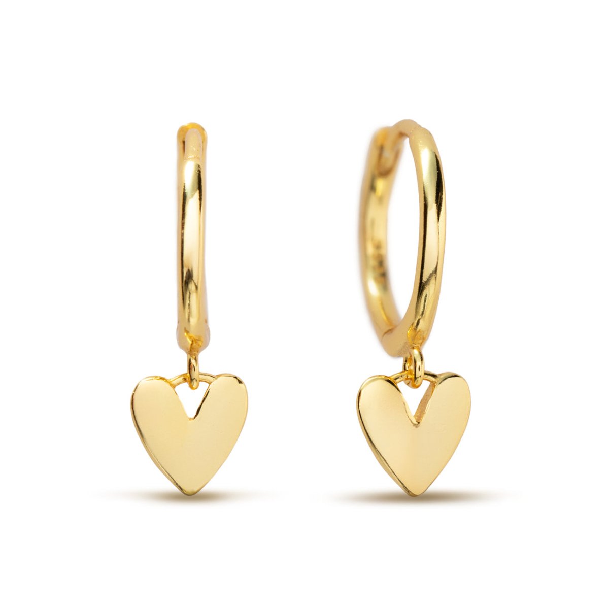 Gold vermeil huggie hoops with small dangling heart charms, on a white background