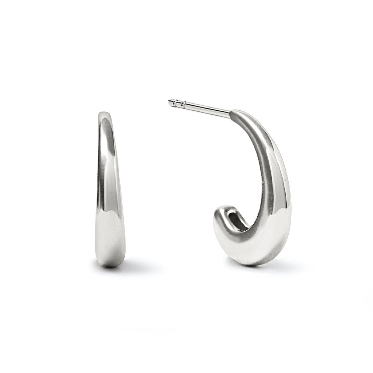 Sterling silver small J hoop earrings with a smooth tapered curve and post backs, on a white background