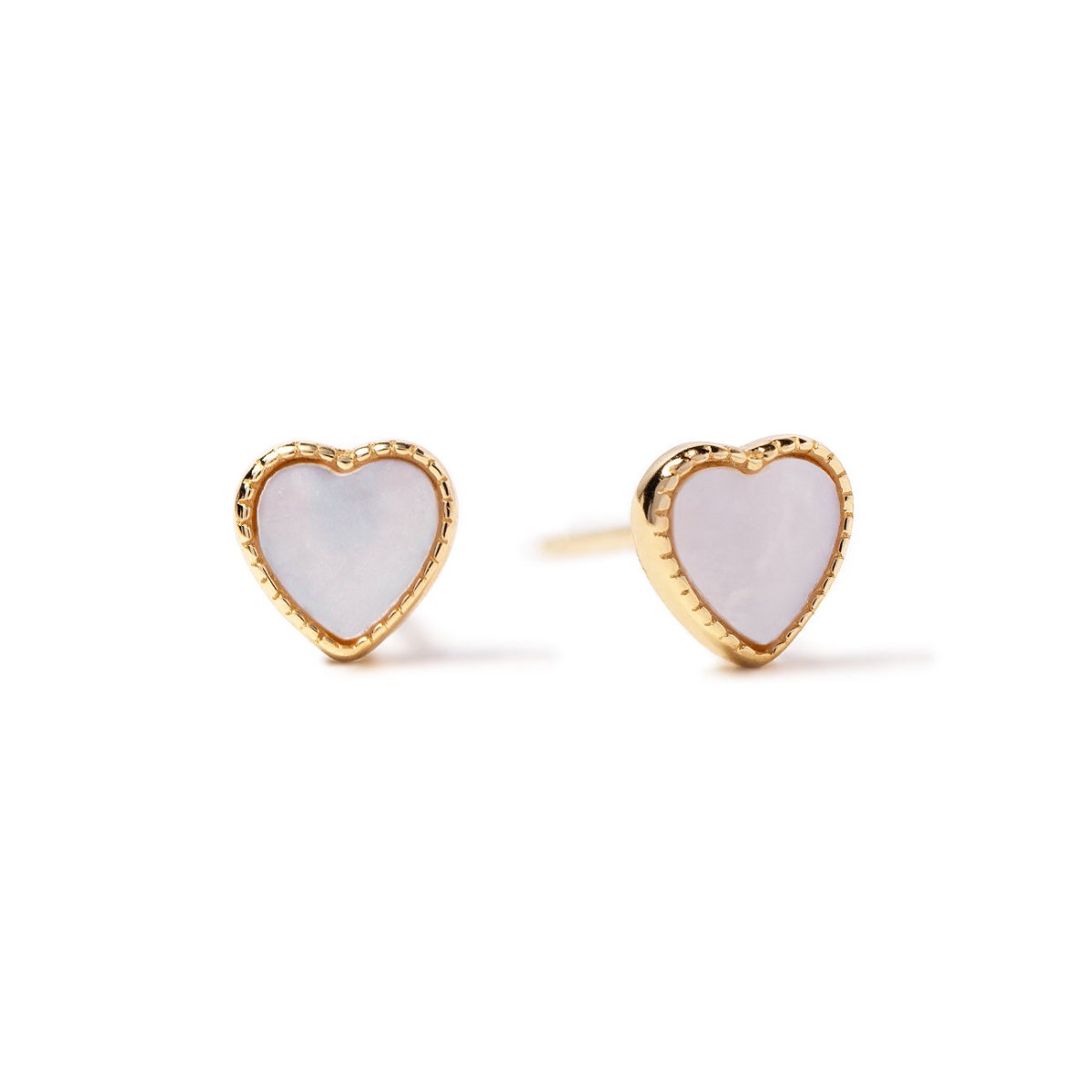 Gold vermeil mini heart stud earrings with white mother of pearl centers, on a white background