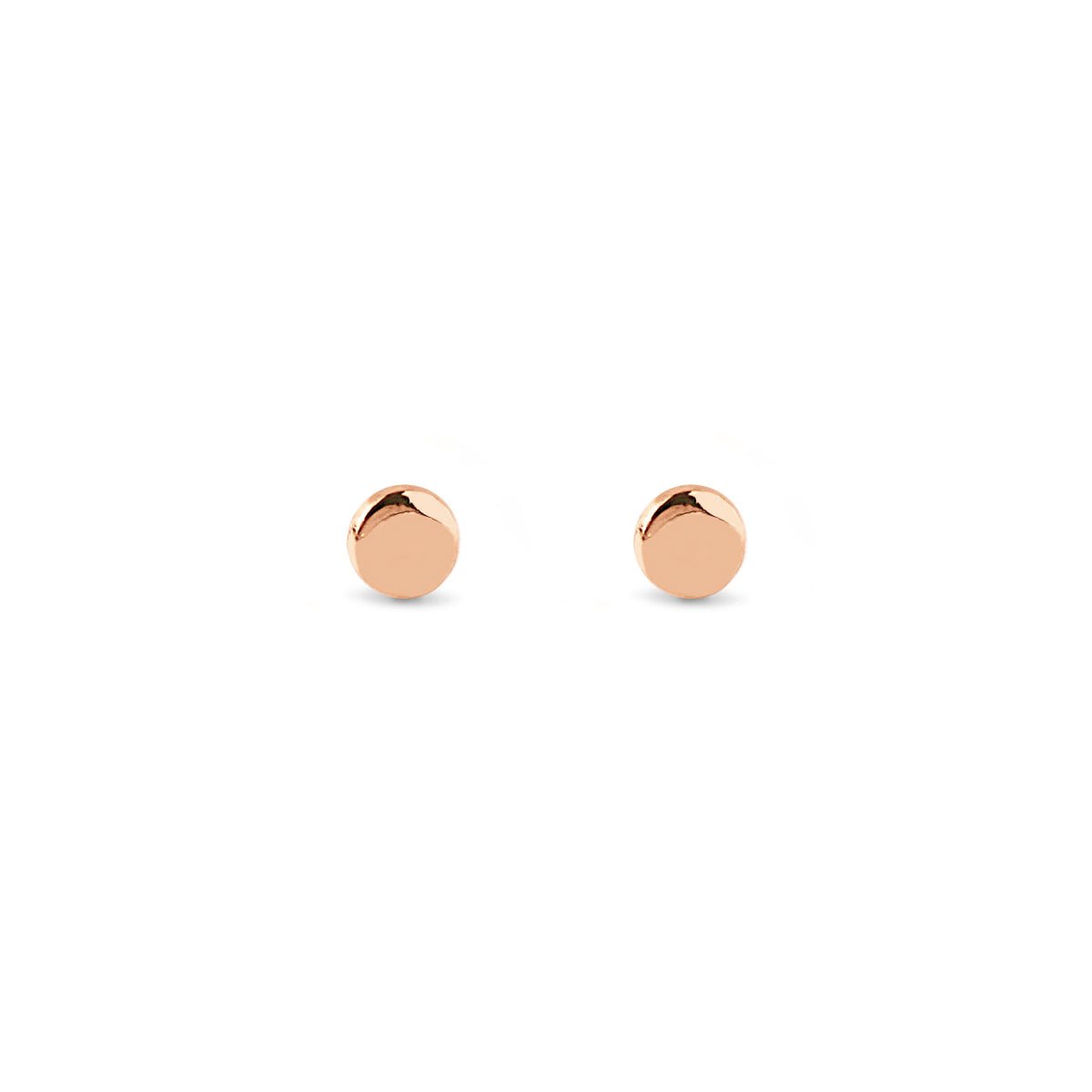 Rose gold vermeil tiny circle stud earrings, on a white background