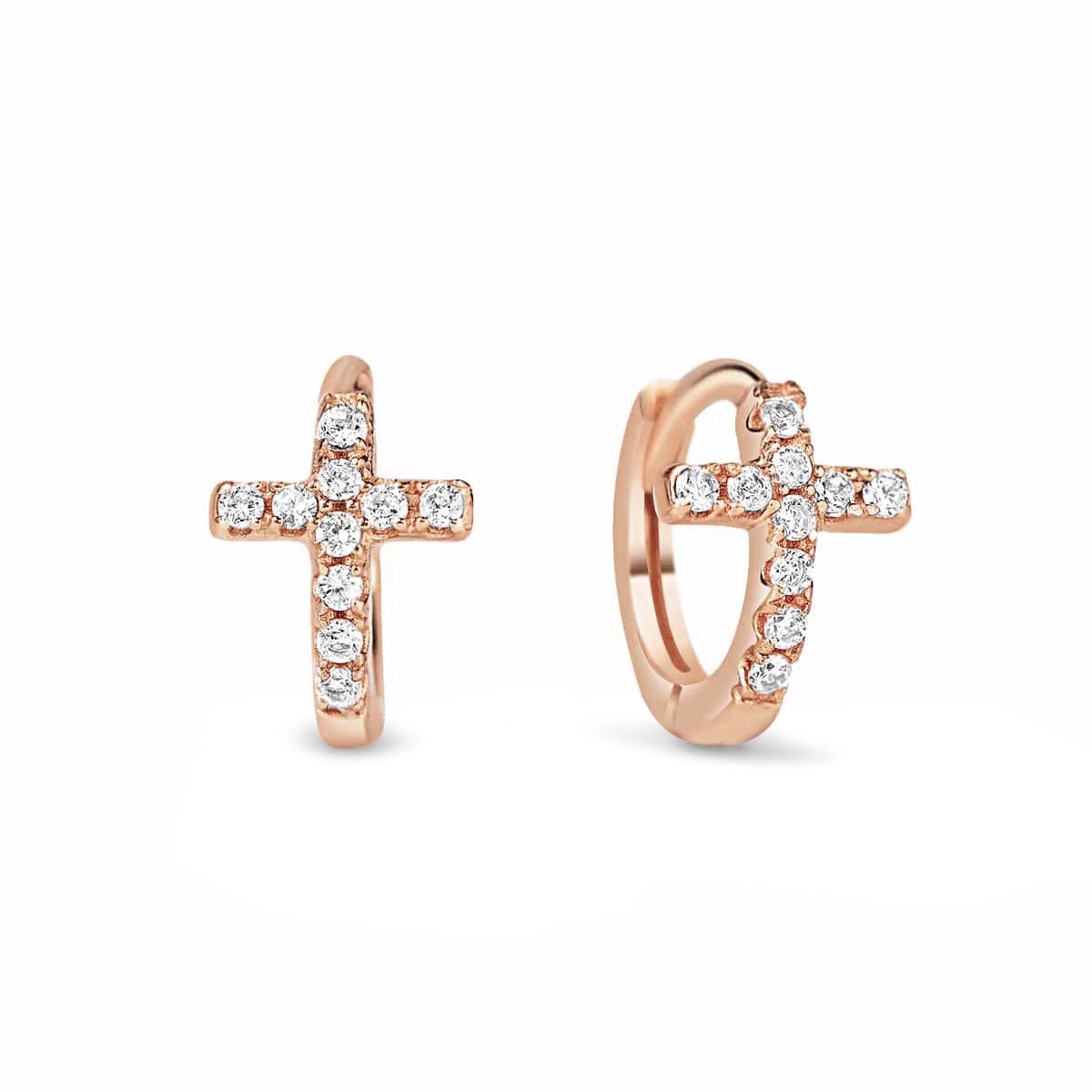 Rose gold vermeil huggie hoops with pavé clear-crystal crosses, close-up detail on a white background