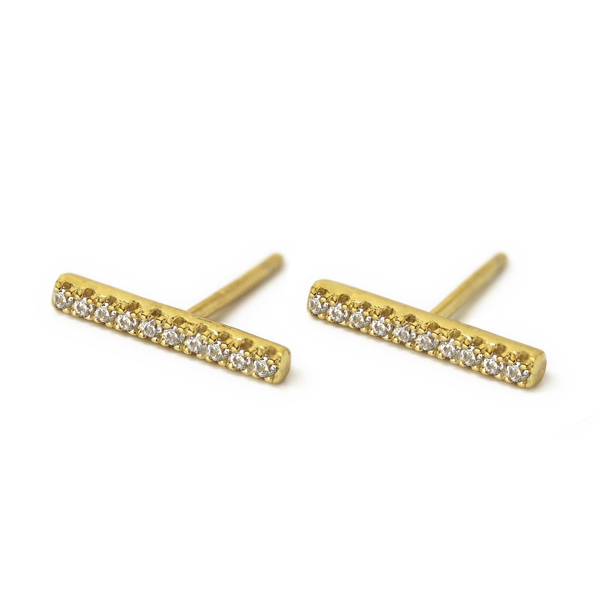 Gold vermeil pavé bar stud earrings set with a row of zirconia, on a white background