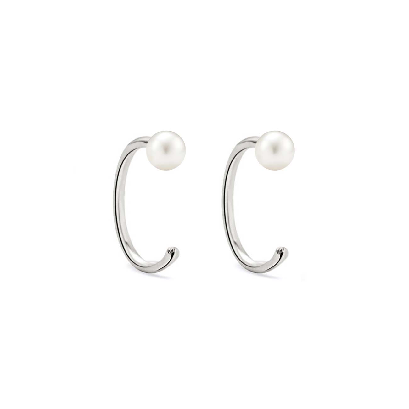 Sterling silver open hug hoop earrings each topped with a pearl, on a white background