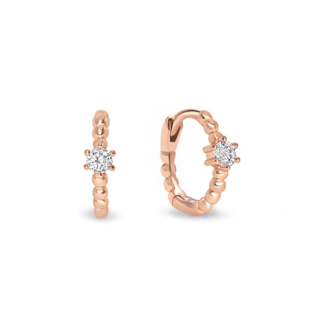 Rose gold vermeil beaded huggie hoops with a white zirconia solitaire, on a white background