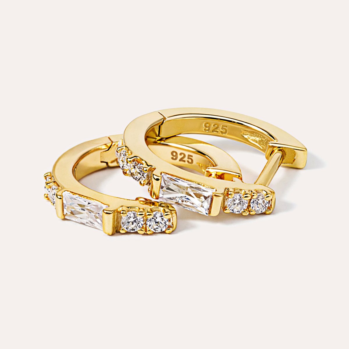 Gold vermeil baguette huggie hoops with white zirconia, close-up detail of the pair