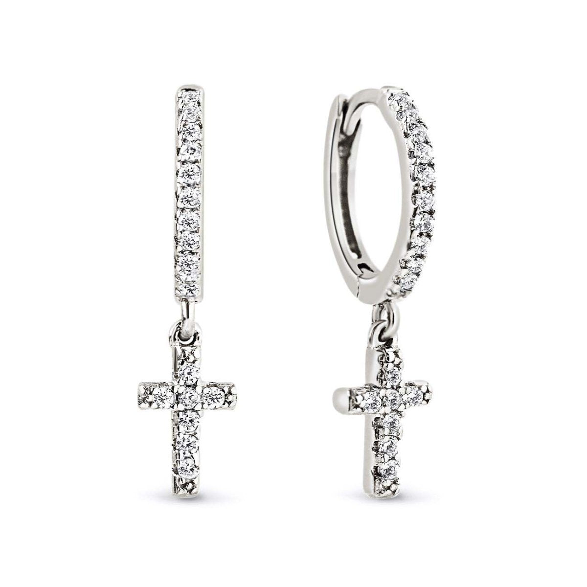 Sterling silver pavé huggie hoops with a dangling pavé cross charm, on a white background