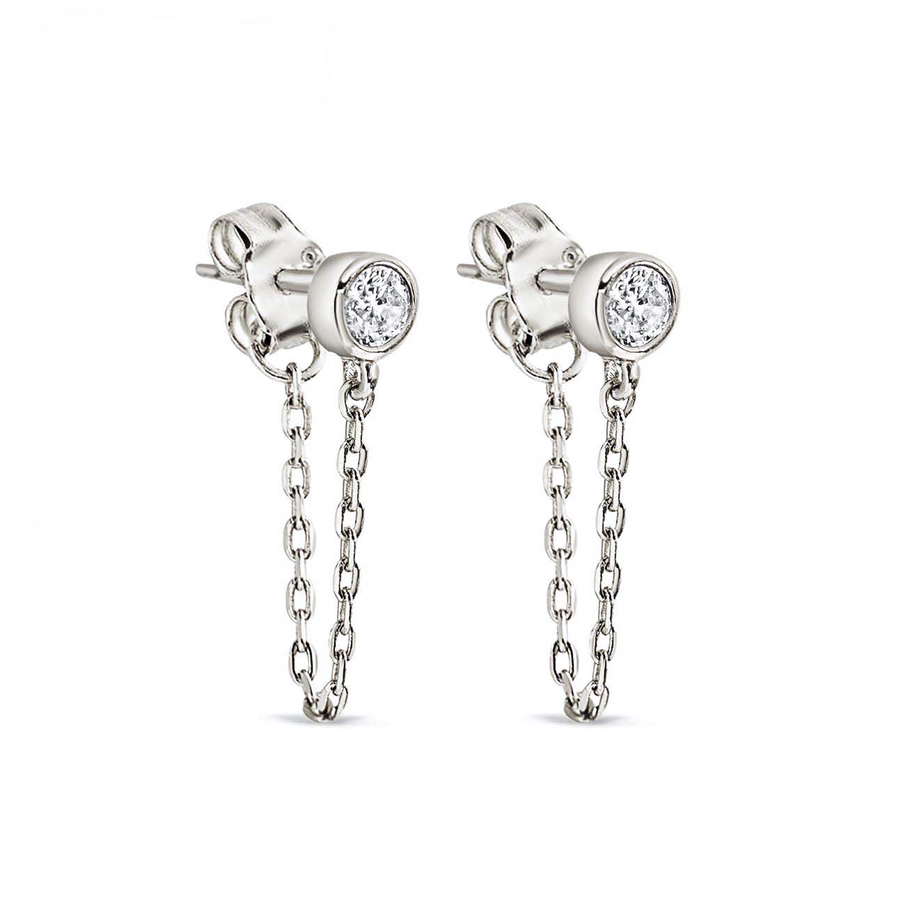 Sterling silver bezel chain huggie earrings with a clear stud and front chain, on a white background