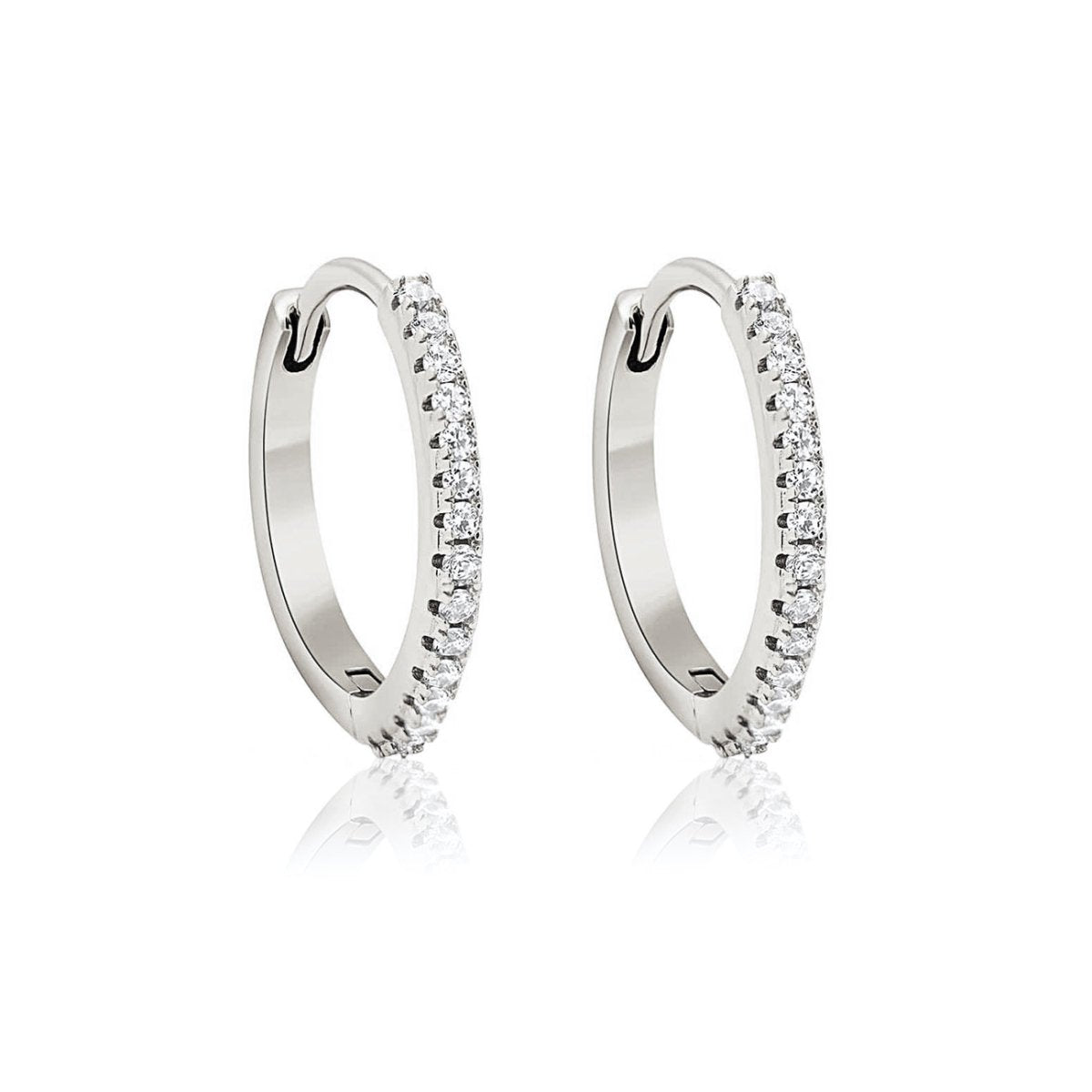 14K white gold pave diamond huggie hoop earrings on a white background