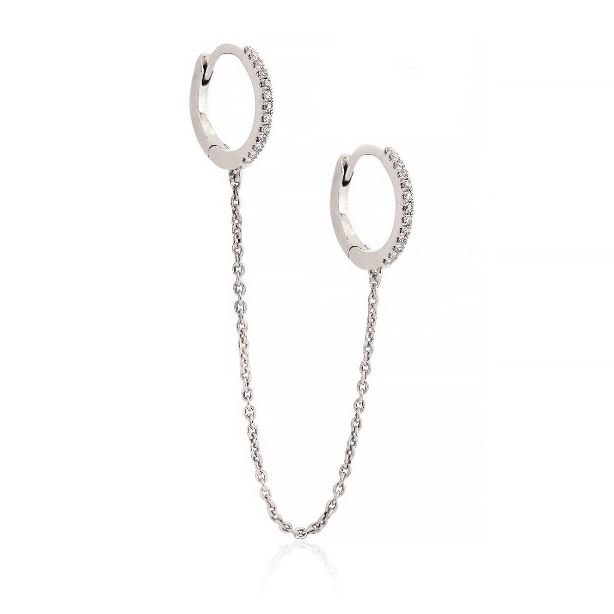 14K white gold diamond pavé double huggie hoops linked by a chain, on a white background