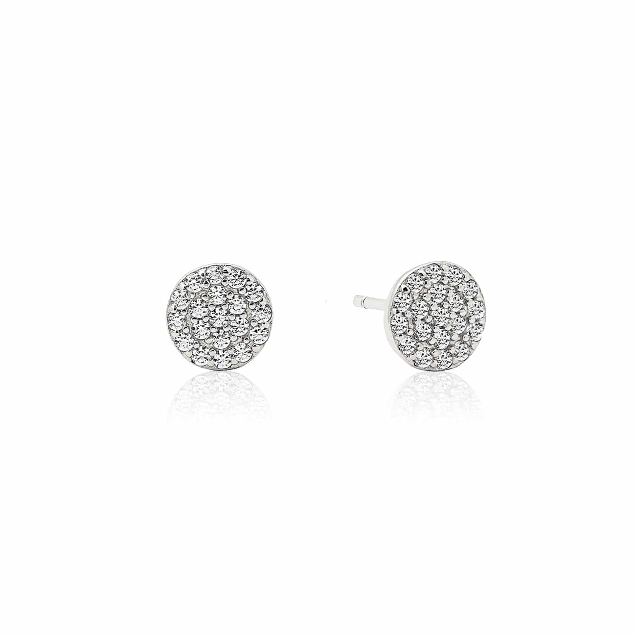 Pair of 14K white gold pavé disc studs with round clear stones, on a white background