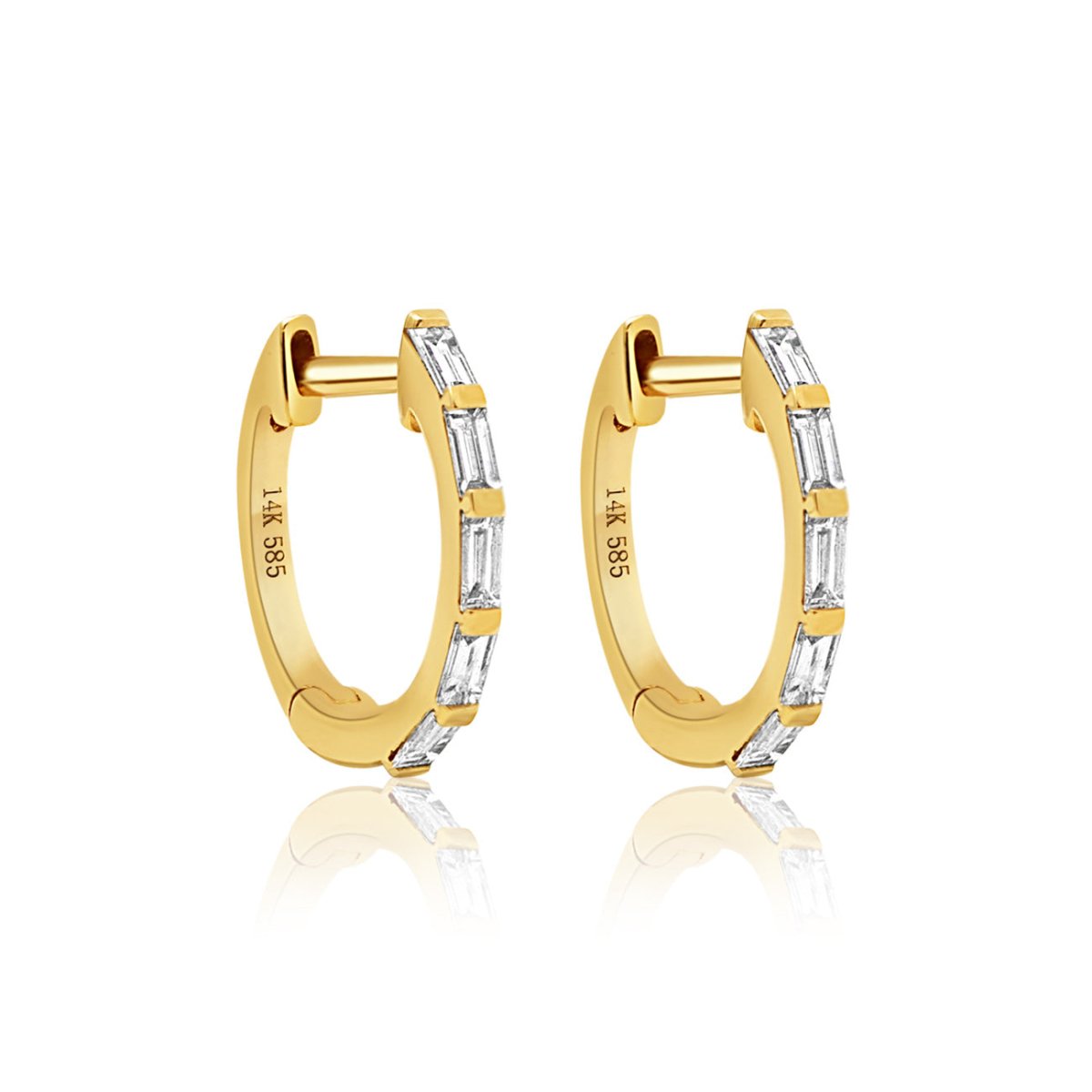14K gold baguette diamond huggie hoops with clear stones, on a white background