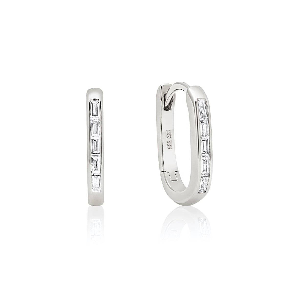 14K white gold oval huggie hoops with channel-set baguette diamonds, front and side, on a white background