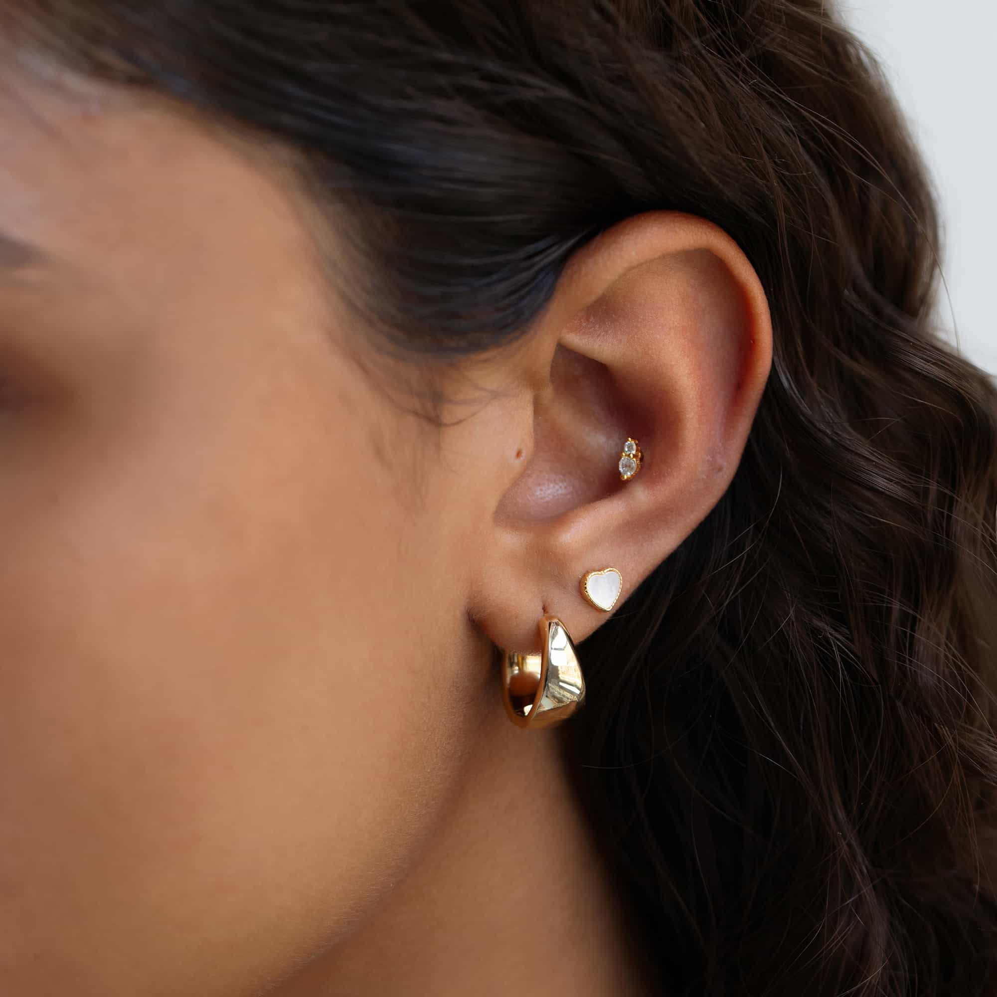 Model wearing flat back earring in conch piercing| #Gemstone_White Zirconia