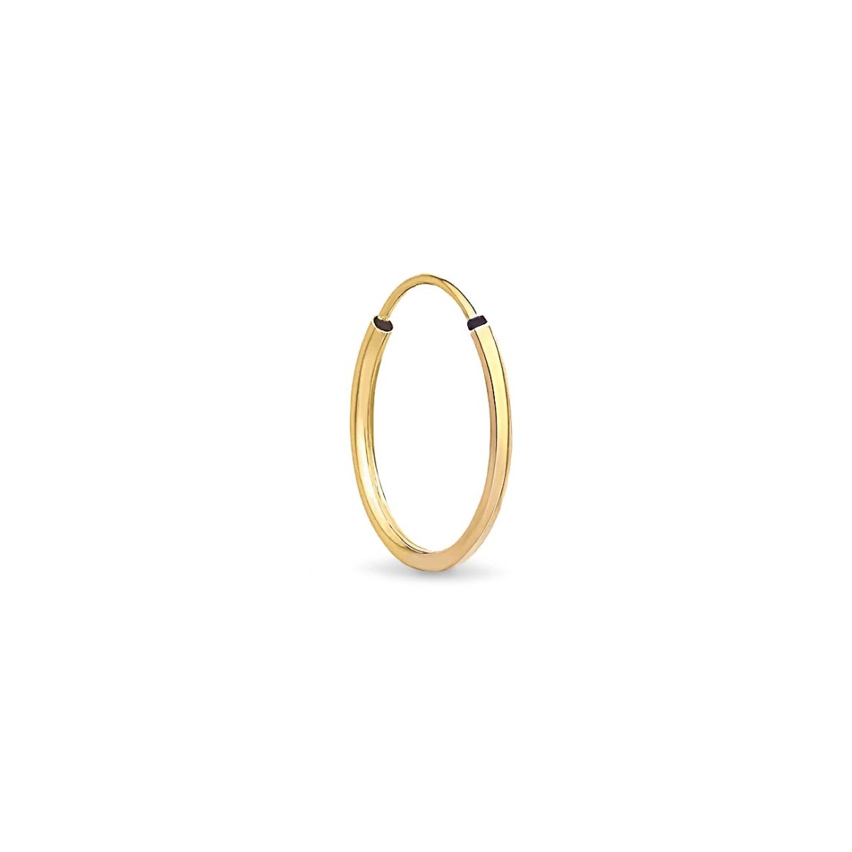 Single 14K gold thin huggie hoop with an endless tube closure, on a white background