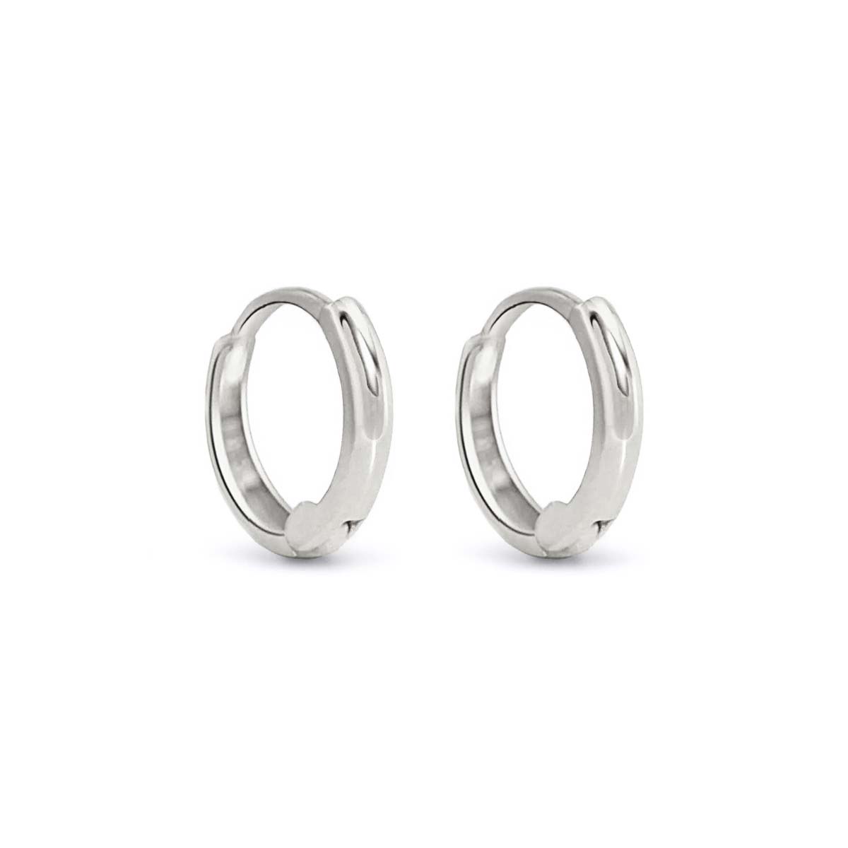 Pair of 14K white gold mini huggie hoop earrings with a hinged closure, on a white background