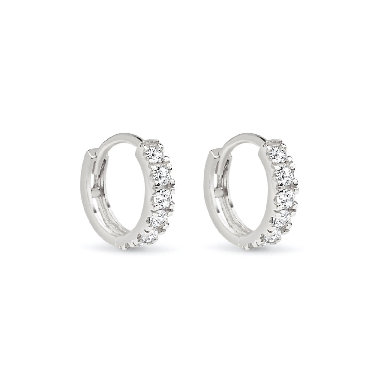 Sterling silver pavé huggie earrings lined with white zirconia, shown as a pair on a white background
