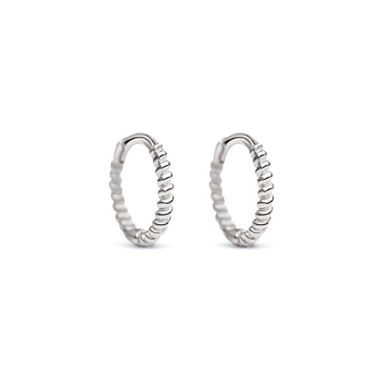 Pair of sterling silver twisted rope huggie hoops, on a white background