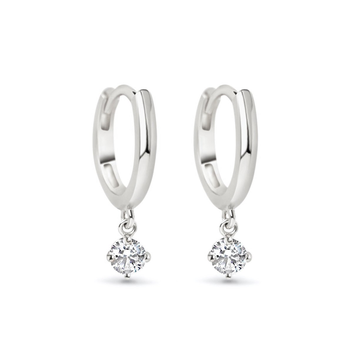 Pair of 14K white gold huggie hoops with a round moissanite dangle, on a white background