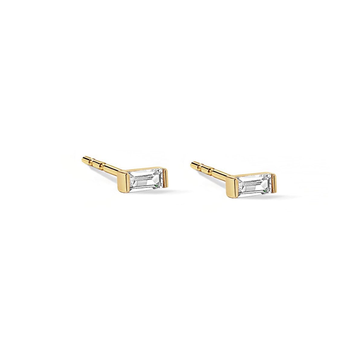 Pair of 14K gold baguette studs with clear white zirconia stones, on a white background