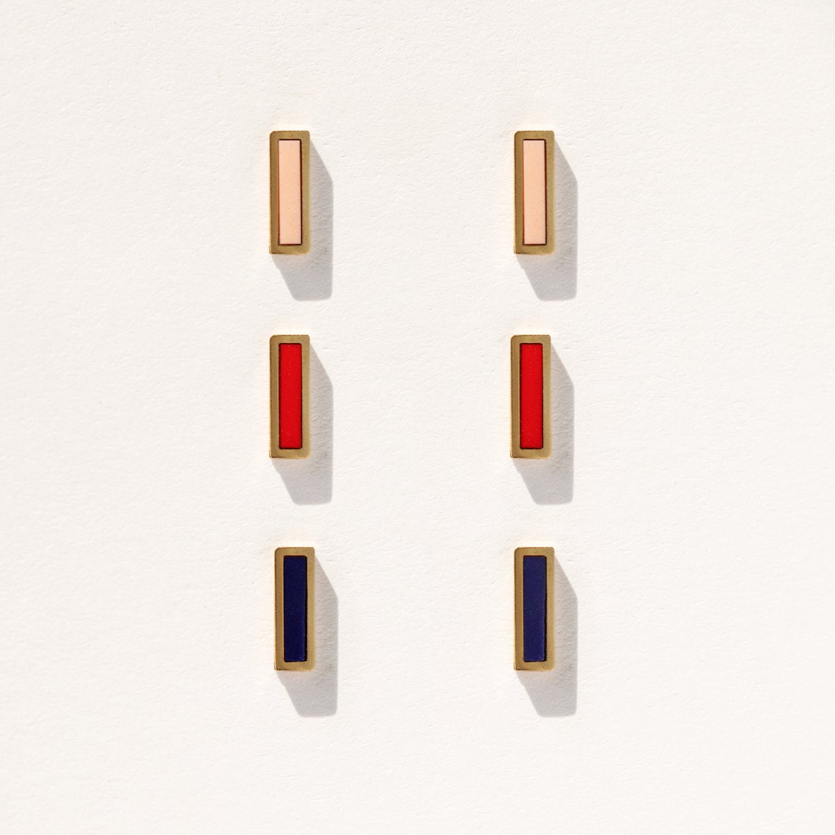 14K gold rectangular inlay bar studs shown in pink, red and navy blue, on a white background