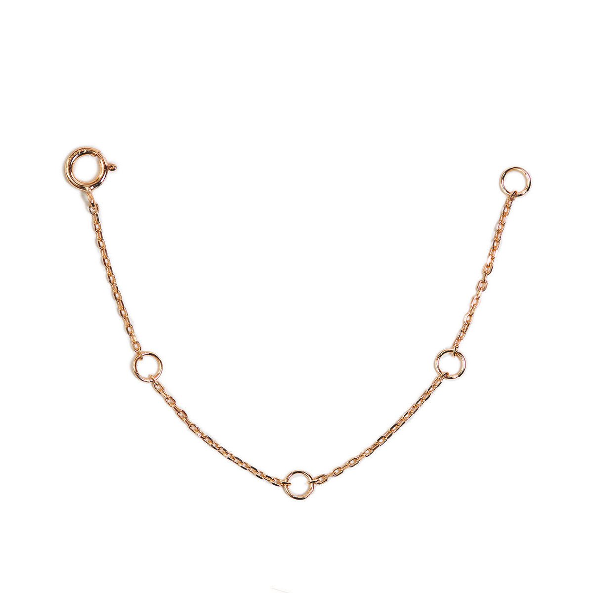Rose gold vermeil body chain extender with adjustable rings and a spring-ring clasp, on a white background